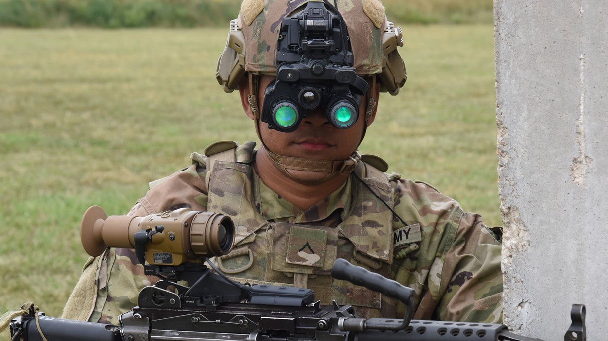 Soldier in uniform wearing night vision goggles