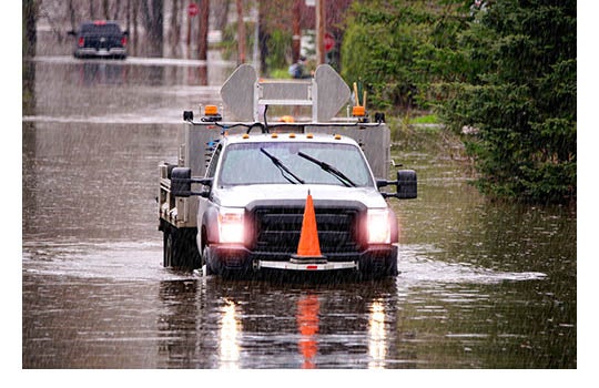 Utility truck at natural disaster site