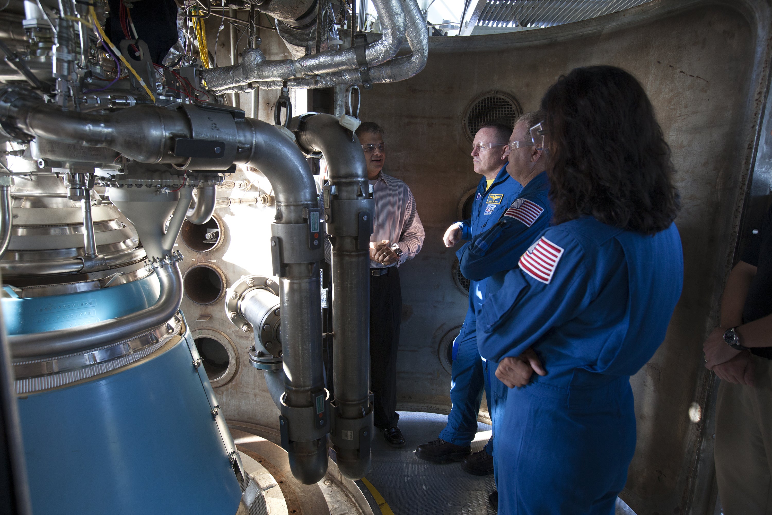 Astronauts speak with an engineer about the RL10 engine 