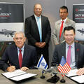 Representatives from IAI and L3Harris sign documents