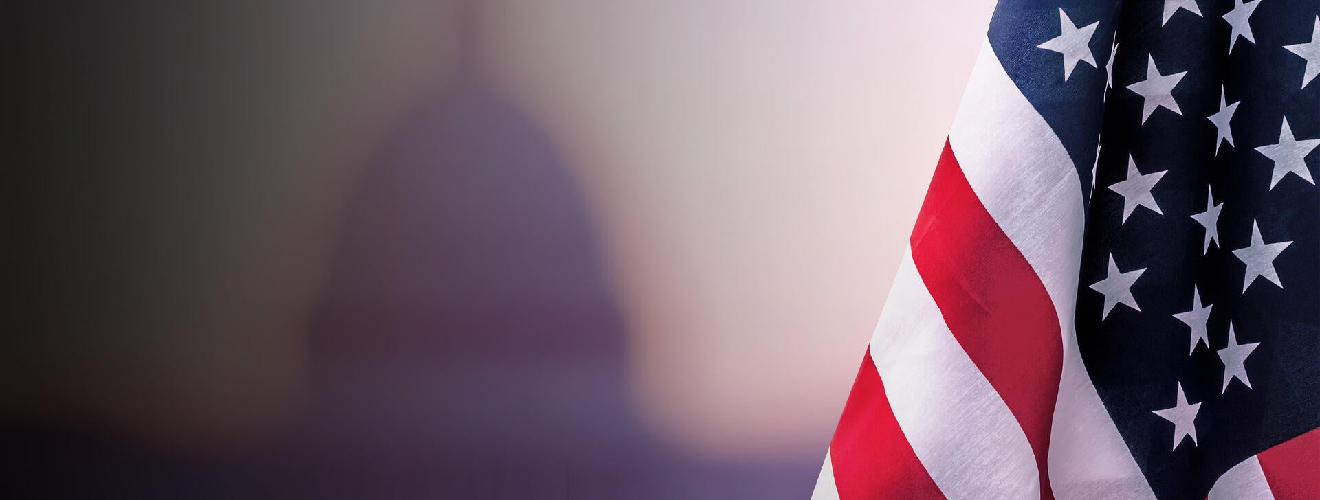 American flag with building in background