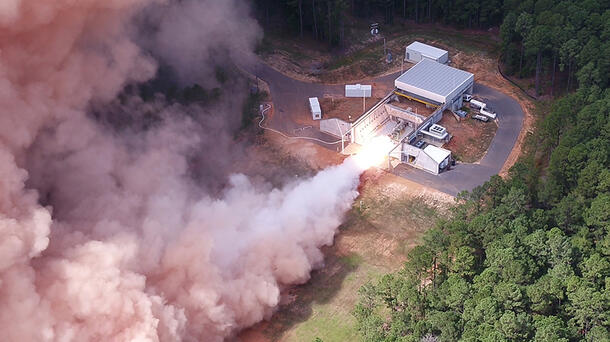 Rocket motor test fires in a forest