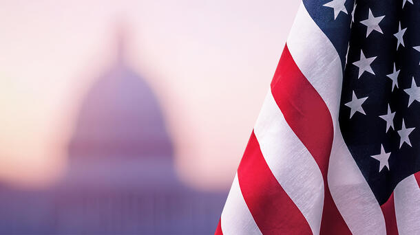 American flag with building in background