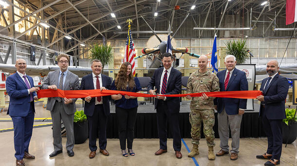 Representatives cut ribbon on a facility in Waco, Texas