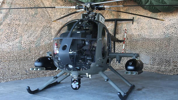 Helicopter sitting in an enclosed area
